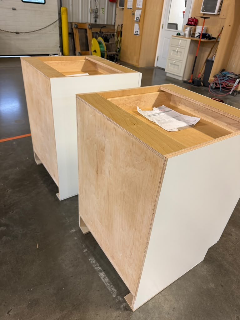 Raw plywood cabinet boxes at the factory