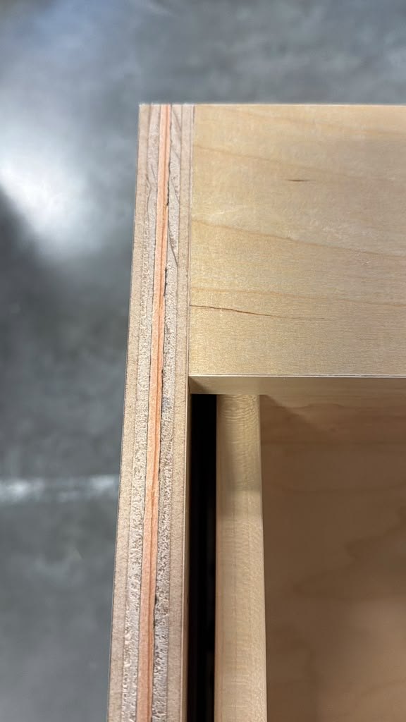 Plywood edge with solid lumber banding